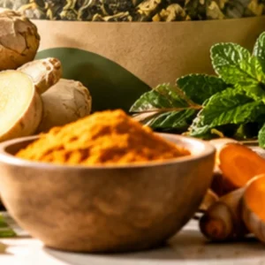 Fresh turmeric and ginger root with ground turmeric